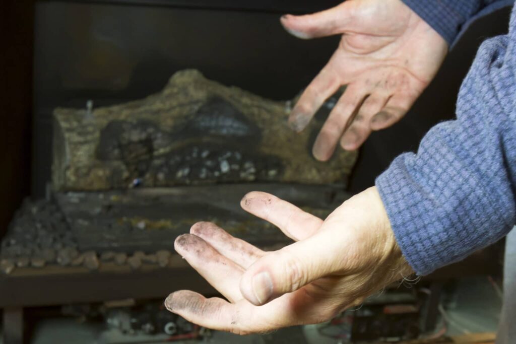 Technician Inspecting a Gas Fireplace