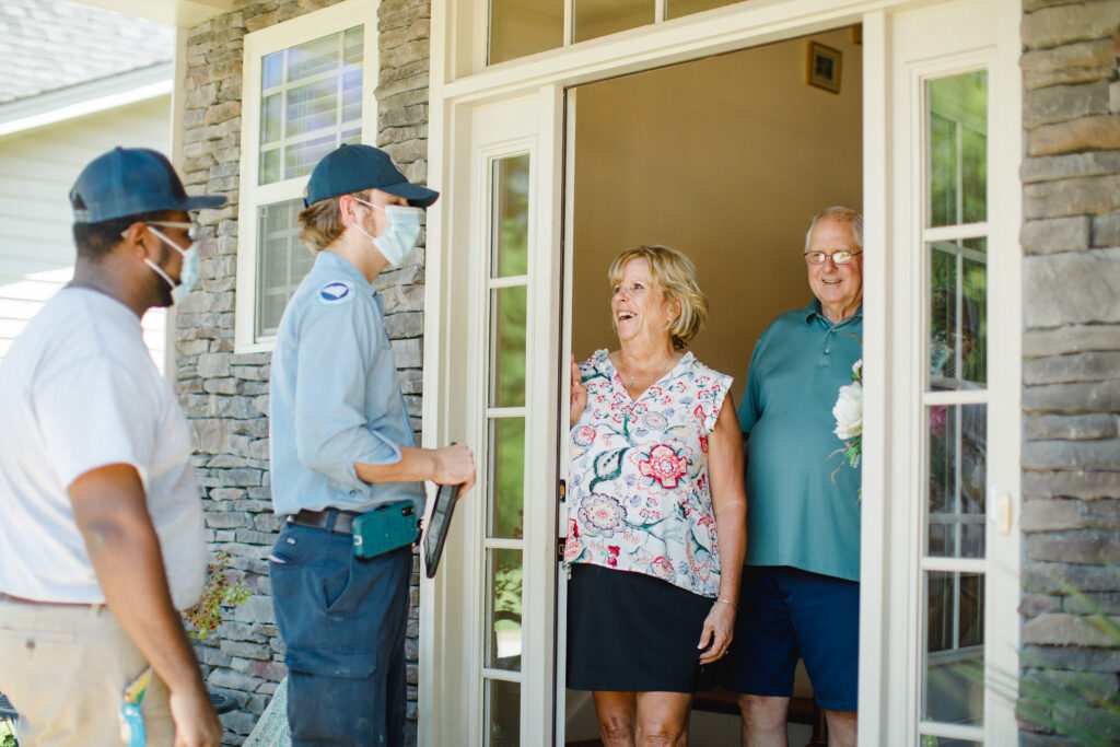 Meetze Plumbers Meeting with Clients at Door