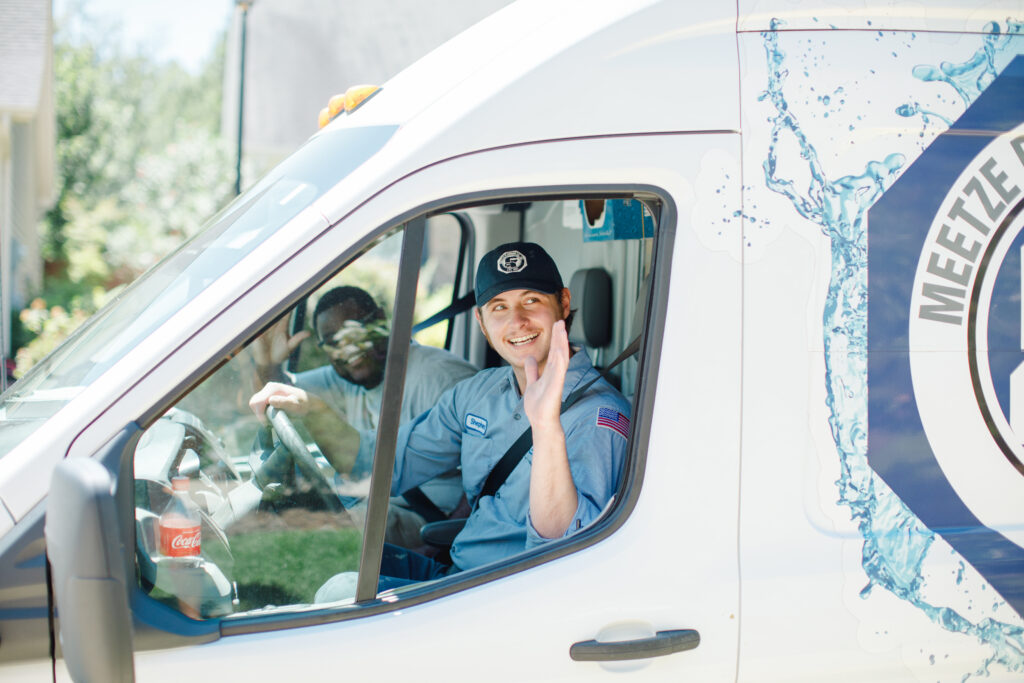 Meetze Plumbing Technician in a Company Van